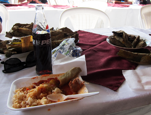 Traditional Guatemalan Graduation Cuisine - pork and rice with tomato sauce and tamalitos