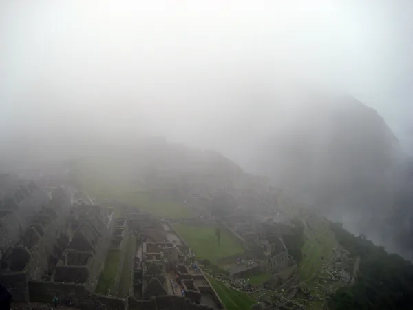 The morning fog rolled into Machu Picchu and carried everyone else out.