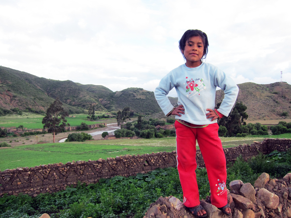 Nicole striking a pose near the river in Morado K'asa